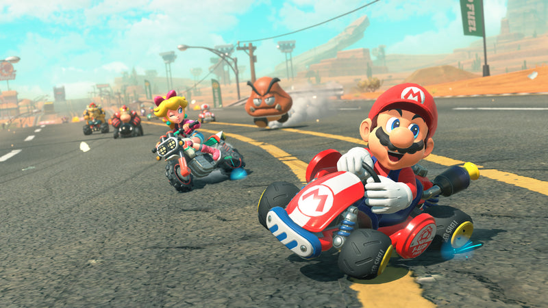 Nintendo characters in racing karts on a street with a colorful background in Mario Kart World on Nintendo Switch 2